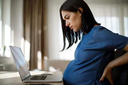 Birthmother uses laptop to research 'What is open adoption?'